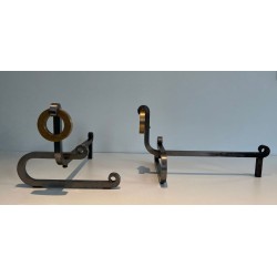 Pair of Modernist Andirons with Large Brass Ring Uprights and Chromed Steel Horseshoe Log Rests. France. Circa 1970.