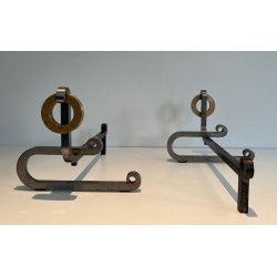Pair of Modernist Andirons with Large Brass Ring Uprights and Chromed Steel Horseshoe Log Rests. France. Circa 1970.