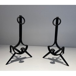 Pair of Modernist Wrought Iron Andirons with Ring Finials and Splayed Tripod Bases. France. Circa 1940.