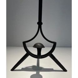 Pair of Modernist Wrought Iron Andirons with Ring Finials and Splayed Tripod Bases. France. Circa 1940.