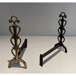Pair of Brass and Wrought Iron Andirons with Stacked Heart-Lobe Uprights in the Manner of Raymond Subes. France. Circa 1940.