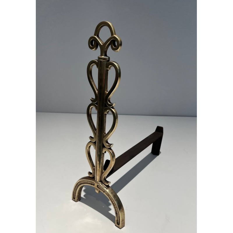 Pair of Brass and Wrought Iron Andirons with Stacked Heart-Lobe Uprights in the Manner of Raymond Subes. France. Circa 1940.