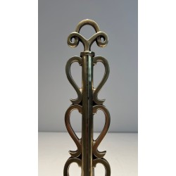Pair of Brass and Wrought Iron Andirons with Stacked Heart-Lobe Uprights in the Manner of Raymond Subes. France. Circa 1940.