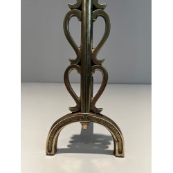 Pair of Brass and Wrought Iron Andirons with Stacked Heart-Lobe Uprights in the Manner of Raymond Subes. France. Circa 1940.