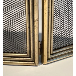 Three-Panel Neoclassical Brass and Wire Mesh Folding Fireplace Screen with Scalloped Crest Rail. France. Circa 1970.