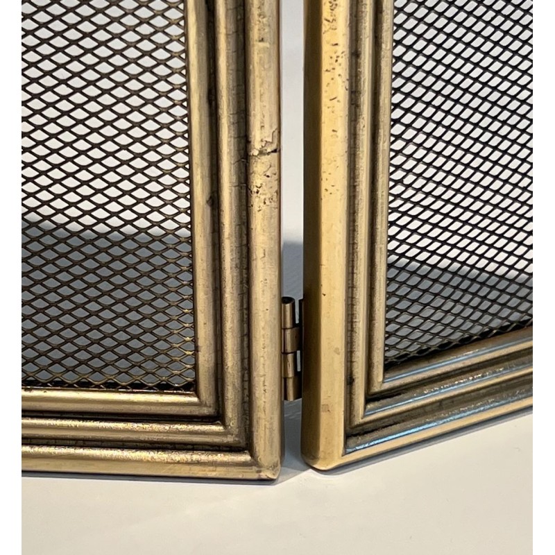 Three-Panel Neoclassical Brass and Wire Mesh Folding Fireplace Screen with Scalloped Crest Rail. France. Circa 1970.