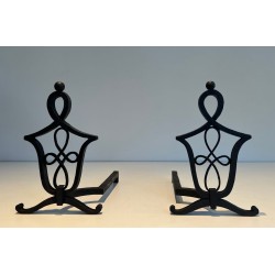 Pair of Wrought Iron Andirons with Interlaced Latticework Uprights in the Manner of Raymond Subes. France. Circa 1940.