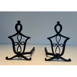 Pair of Wrought Iron Andirons with Interlaced Latticework Uprights in the Manner of Raymond Subes. France. Circa 1940.