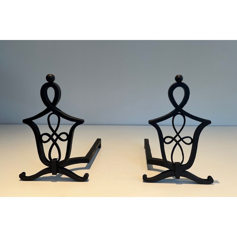 Pair of Wrought Iron Andirons with Interlaced Latticework Uprights in the Manner of Raymond Subes. France. Circa 1940.