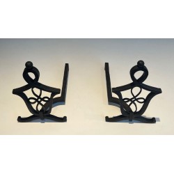 Pair of Wrought Iron Andirons with Interlaced Latticework Uprights in the Manner of Raymond Subes. France. Circa 1940.