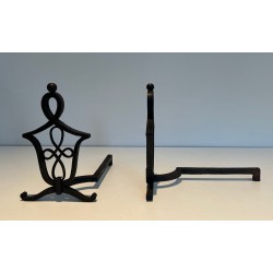 Pair of Wrought Iron Andirons with Interlaced Latticework Uprights in the Manner of Raymond Subes. France. Circa 1940.