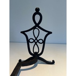 Pair of Wrought Iron Andirons with Interlaced Latticework Uprights in the Manner of Raymond Subes. France. Circa 1940.