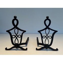 Pair of Wrought Iron Andirons with Interlaced Latticework Uprights in the Manner of Raymond Subes. France. Circa 1940.