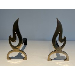 Pair of Brass Andirons with Cut-Out Flame Uprights. France. Circa 1920.