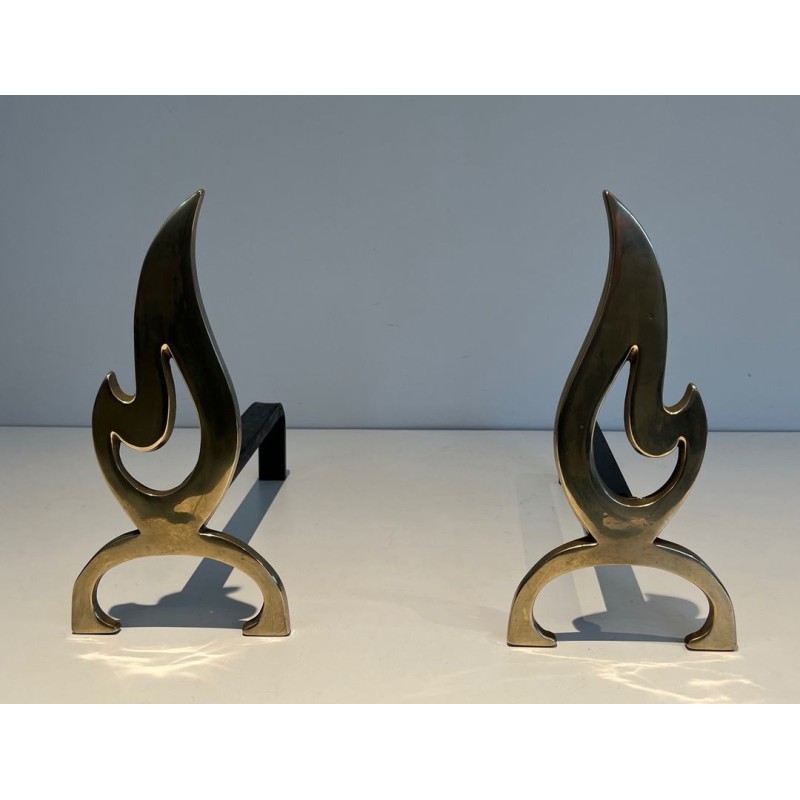 Pair of Brass Andirons with Cut-Out Flame Uprights. France. Circa 1920.