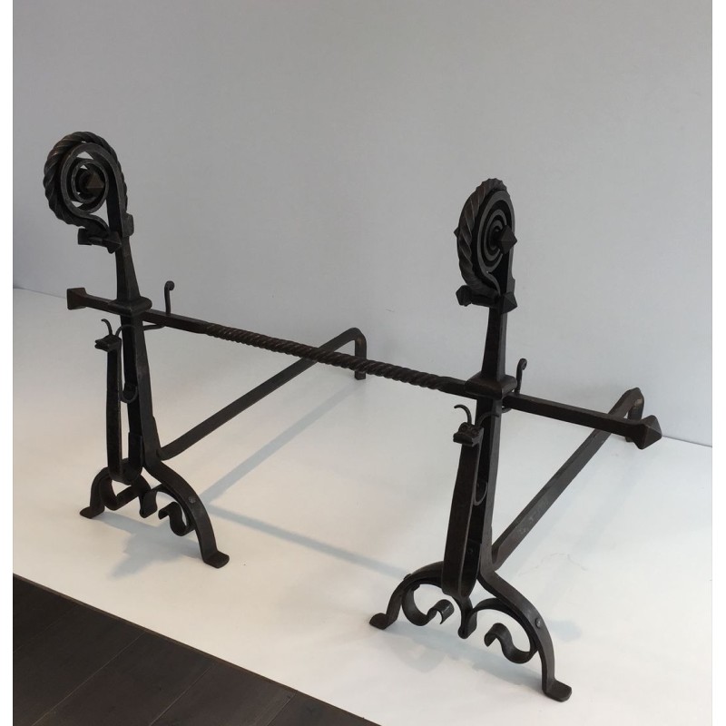 Monumental Pair of Wrought Iron Andirons with Snail-Shell Spiral Finials and Spit-Rest Arms. France. Circa 1900.