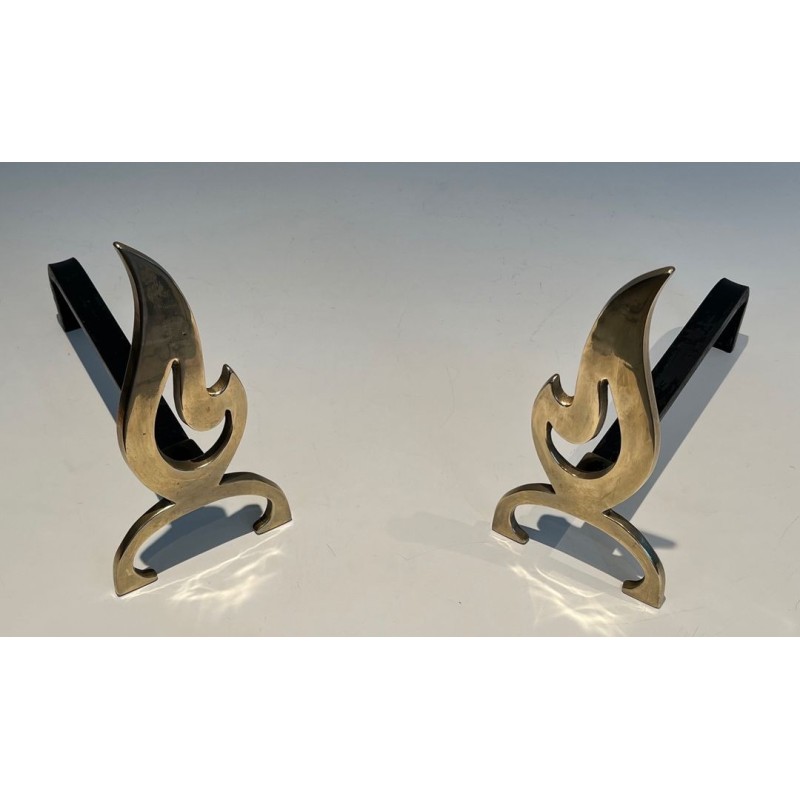 Pair of Brass Andirons with Cut-Out Flame Uprights. France. Circa 1920.