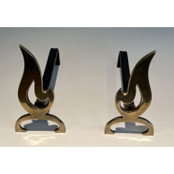 Pair of Brass Andirons with Cut-Out Flame Uprights. France. Circa 1920.