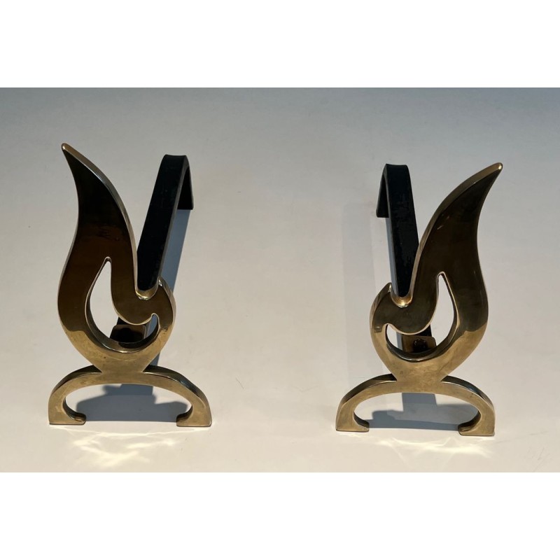 Pair of Brass Andirons with Cut-Out Flame Uprights. France. Circa 1920.