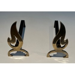 Pair of Brass Andirons with Cut-Out Flame Uprights. France. Circa 1920.
