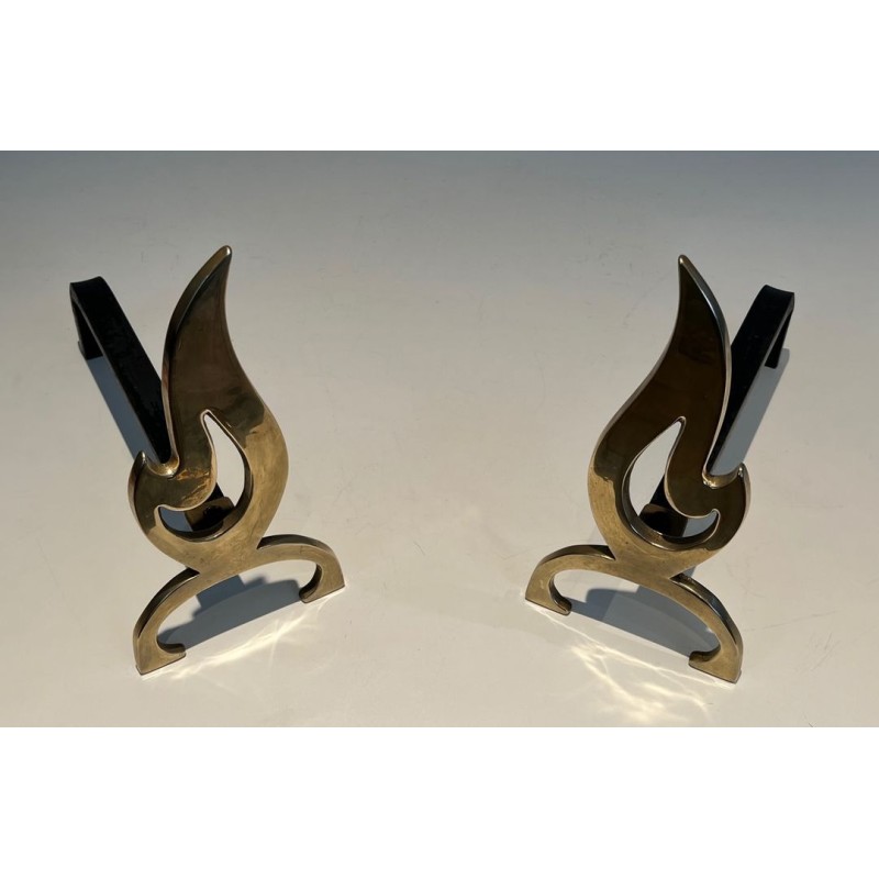 Pair of Brass Andirons with Cut-Out Flame Uprights. France. Circa 1920.