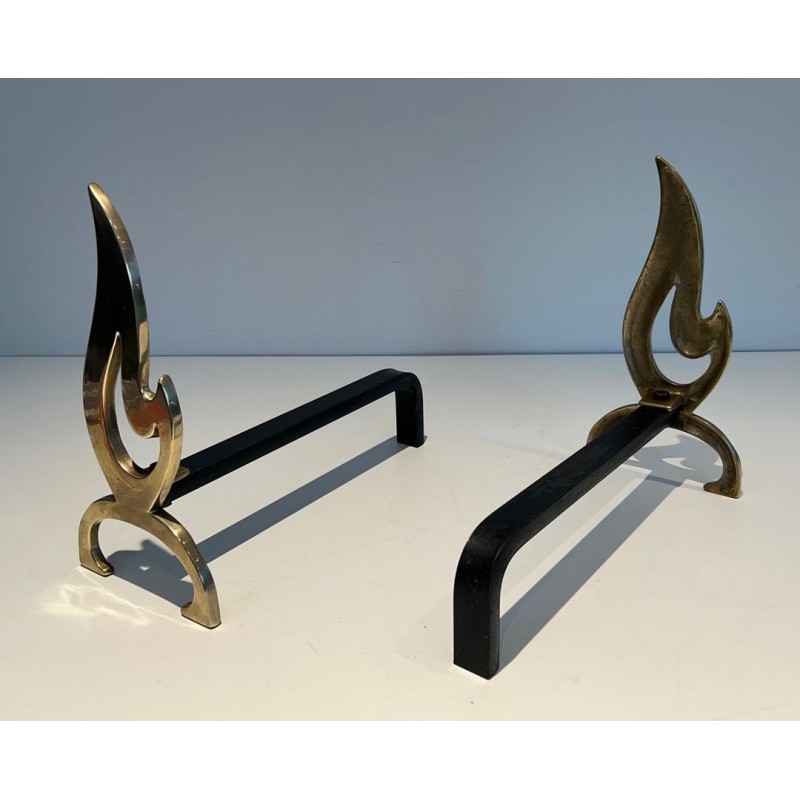 Pair of Brass Andirons with Cut-Out Flame Uprights. France. Circa 1920.
