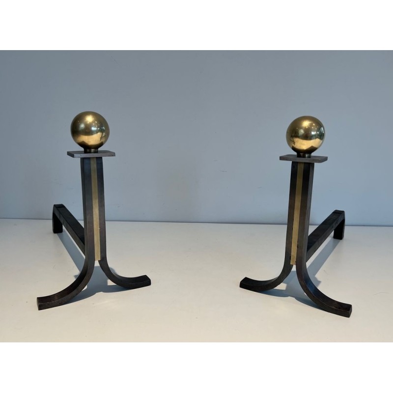 Pair of Modernist Steel and Brass Ball-Finial Andirons in the Manner of Jacques Adnet. France. Circa 1940.