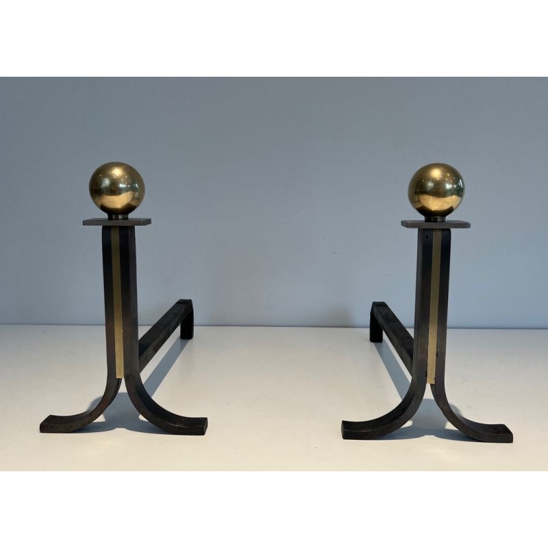 Pair of Modernist Steel and Brass Ball-Finial Andirons in the Manner of Jacques Adnet. France. Circa 1940.