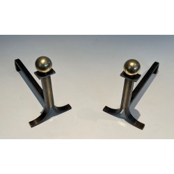 Pair of Modernist Steel and Brass Ball-Finial Andirons in the Manner of Jacques Adnet. France. Circa 1940.