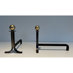 Pair of Modernist Steel and Brass Ball-Finial Andirons in the Manner of Jacques Adnet. France. Circa 1940.