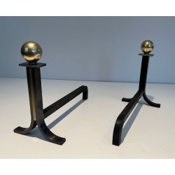 Pair of Modernist Steel and Brass Ball-Finial Andirons in the Manner of Jacques Adnet. France. Circa 1940.