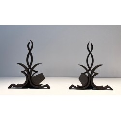 Pair of Wrought Iron Andirons with Figure-Eight Loop Uprights and Scrolled Foliate Feet by Raymond Subes. France. Circa 1940.