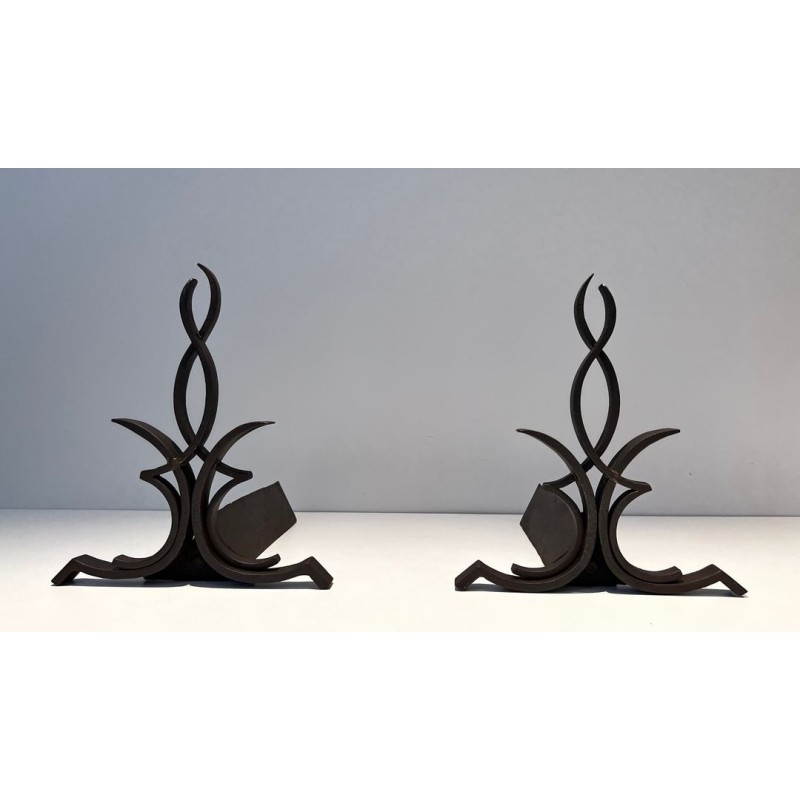 Pair of Wrought Iron Andirons with Figure-Eight Loop Uprights and Scrolled Foliate Feet by Raymond Subes. France. Circa 1940.