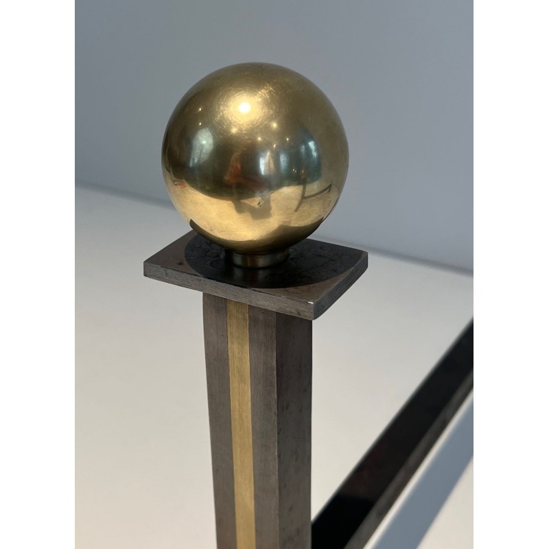 Pair of Modernist Steel and Brass Ball-Finial Andirons in the Manner of Jacques Adnet. France. Circa 1940.