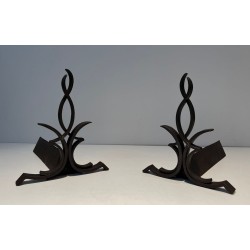 Pair of Wrought Iron Andirons with Figure-Eight Loop Uprights and Scrolled Foliate Feet by Raymond Subes. France. Circa 1940.