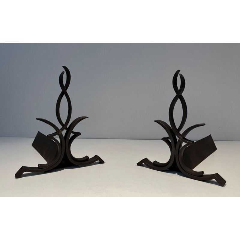 Pair of Wrought Iron Andirons with Figure-Eight Loop Uprights and Scrolled Foliate Feet by Raymond Subes. France. Circa 1940.