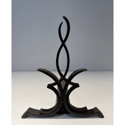 Pair of Wrought Iron Andirons with Figure-Eight Loop Uprights and Scrolled Foliate Feet by Raymond Subes. France. Circa 1940.