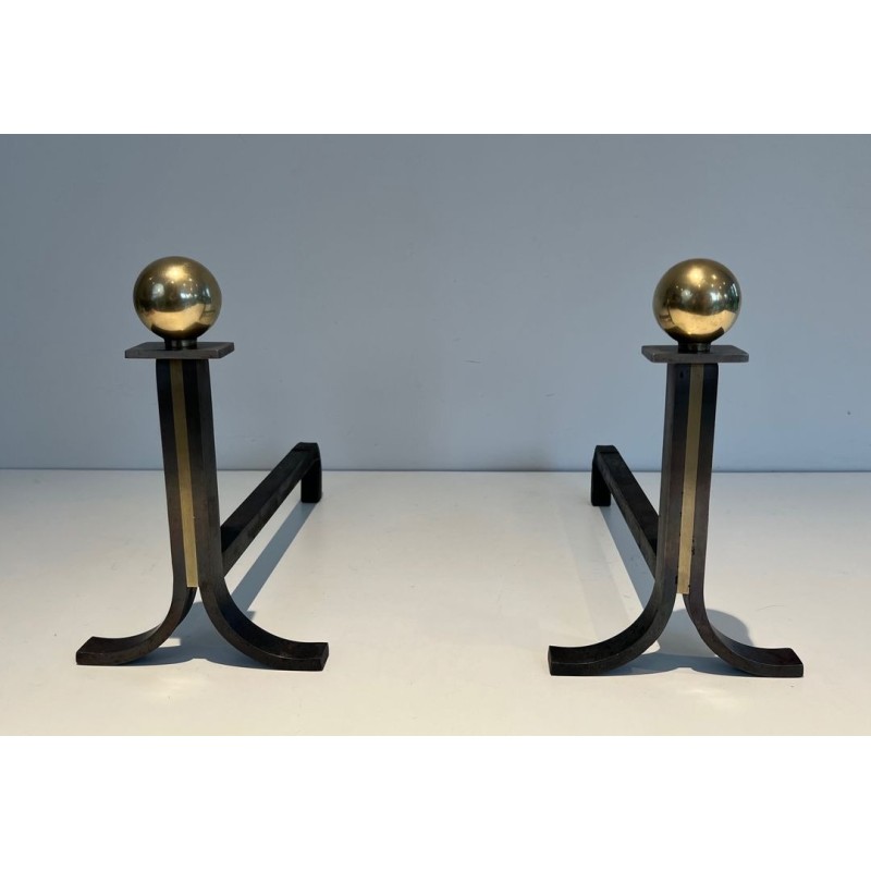 Pair of Modernist Steel and Brass Ball-Finial Andirons in the Manner of Jacques Adnet. France. Circa 1940.