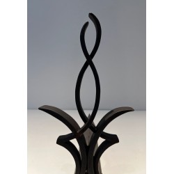 Pair of Wrought Iron Andirons with Figure-Eight Loop Uprights and Scrolled Foliate Feet by Raymond Subes. France. Circa 1940.