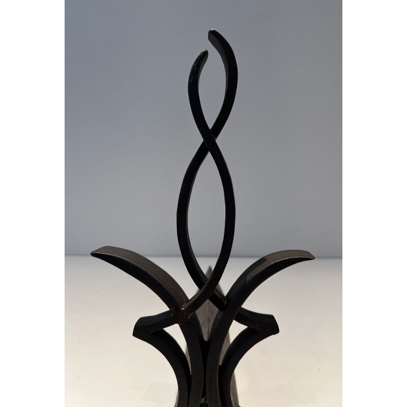 Pair of Wrought Iron Andirons with Figure-Eight Loop Uprights and Scrolled Foliate Feet by Raymond Subes. France. Circa 1940.