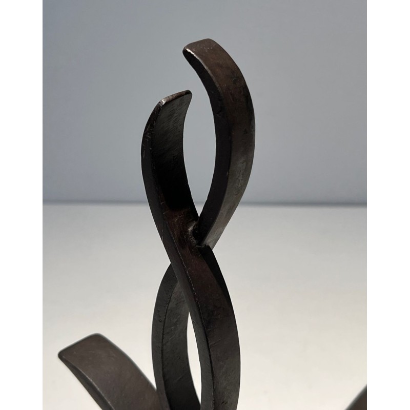 Pair of Wrought Iron Andirons with Figure-Eight Loop Uprights and Scrolled Foliate Feet by Raymond Subes. France. Circa 1940.