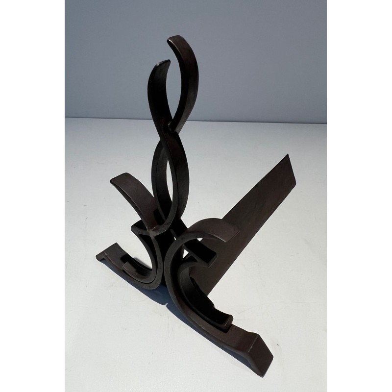 Pair of Wrought Iron Andirons with Figure-Eight Loop Uprights and Scrolled Foliate Feet by Raymond Subes. France. Circa 1940.