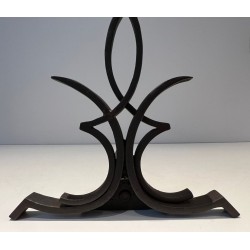 Pair of Wrought Iron Andirons with Figure-Eight Loop Uprights and Scrolled Foliate Feet by Raymond Subes. France. Circa 1940.