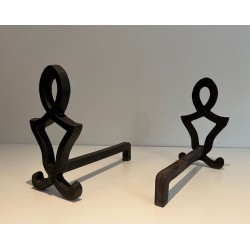 Pair of Wrought Iron Andirons with Oval Loop Finials and Hourglass Uprights by Raymond Subes. France. Circa 1940.