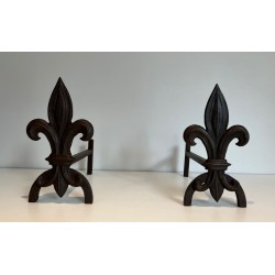Pair of Cast Iron Andirons with Fleur-de-Lys Finials. France. Circa 1970.