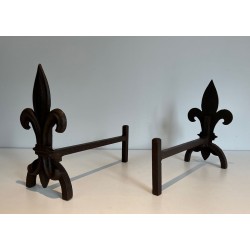 Pair of Cast Iron Andirons with Fleur-de-Lys Finials. France. Circa 1970.