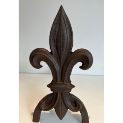 Pair of Cast Iron Andirons with Fleur-de-Lys Finials. France. Circa 1970.