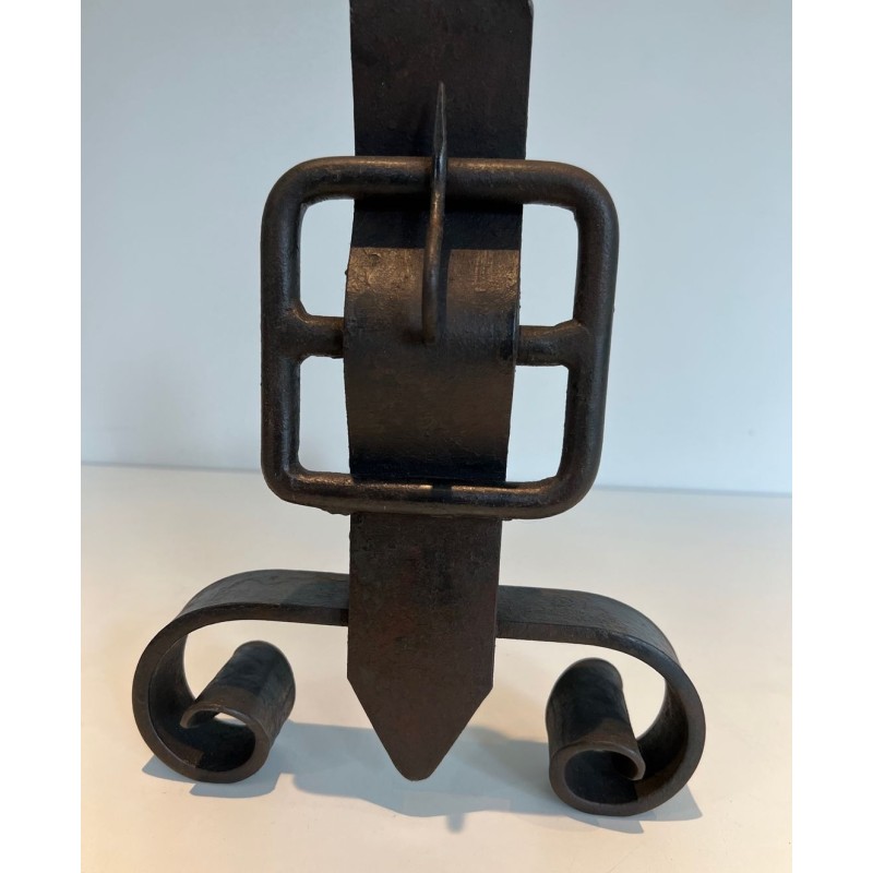 Pair of Wrought Iron Andirons with Flame Finials and Strap-Buckle Midsection. France. Circa 1950.