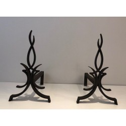 Pair of Wrought Iron Andirons with Foliate and Flame Decoration by Raymond Subes. France. Circa 1940.
