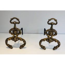 Pair of Neoclassical Bronze and Wrought Iron Andirons with Lion Mascarons. France. Circa 1940.